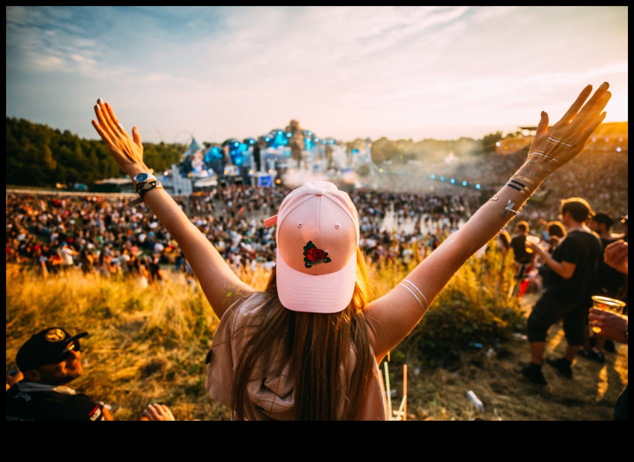 How do landscapes contribute to the visual appeal of outdoor music festivals?